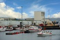 Harbor of factories and warehouses in Icelandic countryside There are many boats mooring