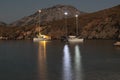 Harbor Lights: Nocturnal Tranquility by the Grecian Shore