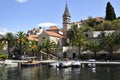 Harbor in the little village Splitska on Brac Island in Croatia, with some small boats and the old church.