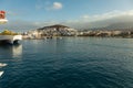 Harbor in Los Cristianos, Tenerife, Spain - May 25, 2019: On the left - Ferry Fred Olsen to La Gomera early morning in the port of