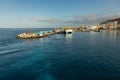 Harbor in Los Cristianos, Tenerife, Spain - May 25, 2019: On the left - Ferry Fred Olsen to La Gomera early morning in the port of
