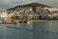 Harbor in Los Cristianos, Tenerife, Spain - May 25, 2019: On the left - fishing boats and tourist yachts early morning in the port