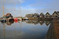 The harbor of Marken, a fishing village with traditional wooden houses and sailing boats, located in the North of Amsterdam