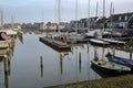 The harbor of Marken, a fishing village with traditional wooden houses and sailing boats, located in the North of Amsterdam