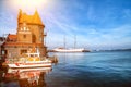 The harbor master house old pilot house or Lotsenhaus, a docket boat and In the background a sailing ship