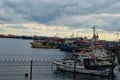 Harbor with moored fishing boats and ships in Istanbul. man sets sail on his boat. Royalty Free Stock Photo
