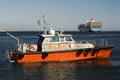 Harbor Pilot Boat and Container Ship Royalty Free Stock Photo