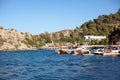 Harbor and port in resort village with moored touristic boats and ships. Marina in Turunc. Boat taxi to move tourists