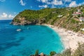 Harbor with sand beach, blue sea and mountain landscape in gustavia, st.barts. Summer vacation on tropical beach