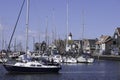 Harbor of small fishing town Urk west harbour with fishing and sailing boats and lighthouse Royalty Free Stock Photo