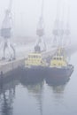 Harbor tug boats moored in a dock Royalty Free Stock Photo