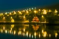 Harbor village houses and boats. Night with beautiful lights. Iceland. Royalty Free Stock Photo