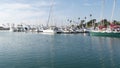 Harbor village, yachts sailboats in marina. Nautical vessels in sea port. Oceanside, California USA