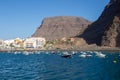 The Harbor of Vueltas in Valle Gran Rey with boats, buildings and mountains