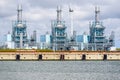 Harborside natural gas power plant under cloudy sky