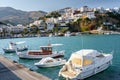 Harbour of Aghia Galini town with parked fishing boats and beautiful houses on the rocks at Crete island Royalty Free Stock Photo