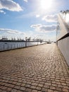 Harbour area in the Hamburg along the river with cranes and buildings