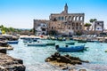 The harbour and beach at Cala San Vito, Puglia, Italy viewed from the harbour entrance