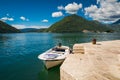 Harbour and boat at Boka Kotor bay (Boka Kotorska), Montenegro, Europe. Royalty Free Stock Photo