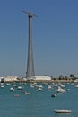 Harbour of Cadiz with one of the famous pylons supporting a power line over the bay of Cadiz and industrial cranes