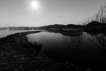 Harbour on a lake at dusk, with star shaped moon Royalty Free Stock Photo