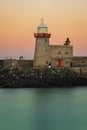 Harbour lighthouse at sunset. Howth. Dublin. Ireland Royalty Free Stock Photo