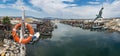 Harbour of Port Leucate with oyster farms and fisher boats on a pier