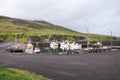 The harbour at Puffin Marina with small boats at northeast of Iceland where the bird watching tours are held