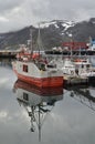 Harbour with smal fishing boats Norway rough cold wet Royalty Free Stock Photo