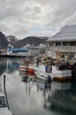 Harbour with smal fishing boats Norway rough cold wet Royalty Free Stock Photo