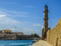 The harbour wall and lighthouse in Chania harbour, Crete on a bright sunny day Royalty Free Stock Photo