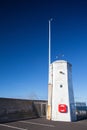 The harbour wall and white lighthouse,Seahouses Royalty Free Stock Photo