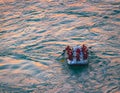 Young persons rafting on the Ganges river in Rishikesh, extreme and fun sport at tourist attraction Royalty Free Stock Photo