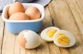 Hard boiled chicken eggs on rustic wooden table Royalty Free Stock Photo