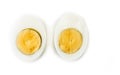Hard boiled egg cut in halves on the white. Royalty Free Stock Photo