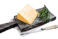 Hard cheese with knive on wooden cutting board. Parmesan. Isolated on white background, top view.
