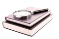 Hard cover book and magnifier isolated