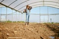 A hard days work deserves a reward. a young female farmer looking tired after a day of hard work on her farm. Royalty Free Stock Photo