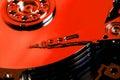 The hard disk from the computer HDD is red, with a mirror effect. The hard drive from the computer has opened Royalty Free Stock Photo