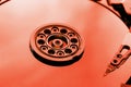 The hard disk from the computer HDD is red, with a mirror effect. The hard drive from the computer has opened Royalty Free Stock Photo