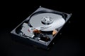 Hard disk contents with binary code on black background Royalty Free Stock Photo