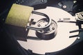 Hard disk drive plate with a padlock on it. Internet data privacy information cyber crime security concept. Toned image Royalty Free Stock Photo