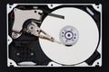 Hard disk drive with removed cover, hdd inside flat view, spindle, actuator arm, read write head, platter, ribbon cable Royalty Free Stock Photo