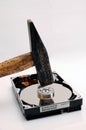 Hard disk and a hammer Royalty Free Stock Photo