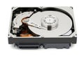 Hard drive with cover removed exposing internal components and platter Royalty Free Stock Photo