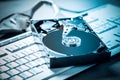Hard drive on keyboard in blue tone Royalty Free Stock Photo