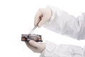 Hard drive and tweezers Royalty Free Stock Photo