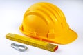 Hard hat with folded ruler Royalty Free Stock Photo