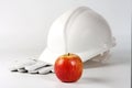 Hard hat , gloves and apple Royalty Free Stock Photo