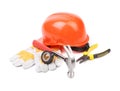 Hard hat, hammer, pliers and work gloves. Royalty Free Stock Photo